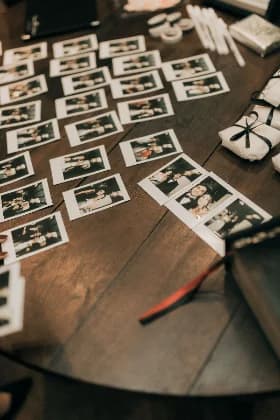 Printed photo strips scattered on a table